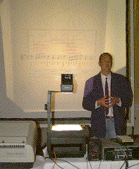 Gerhard Widmer speaking in front of a projected slide