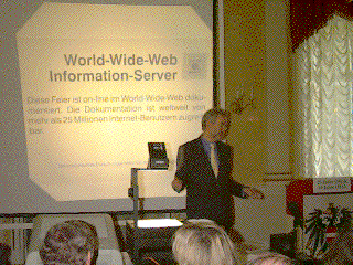 Robert Trappl speaks in front of a projected slide with the title "World-Wide-Web Information Server"