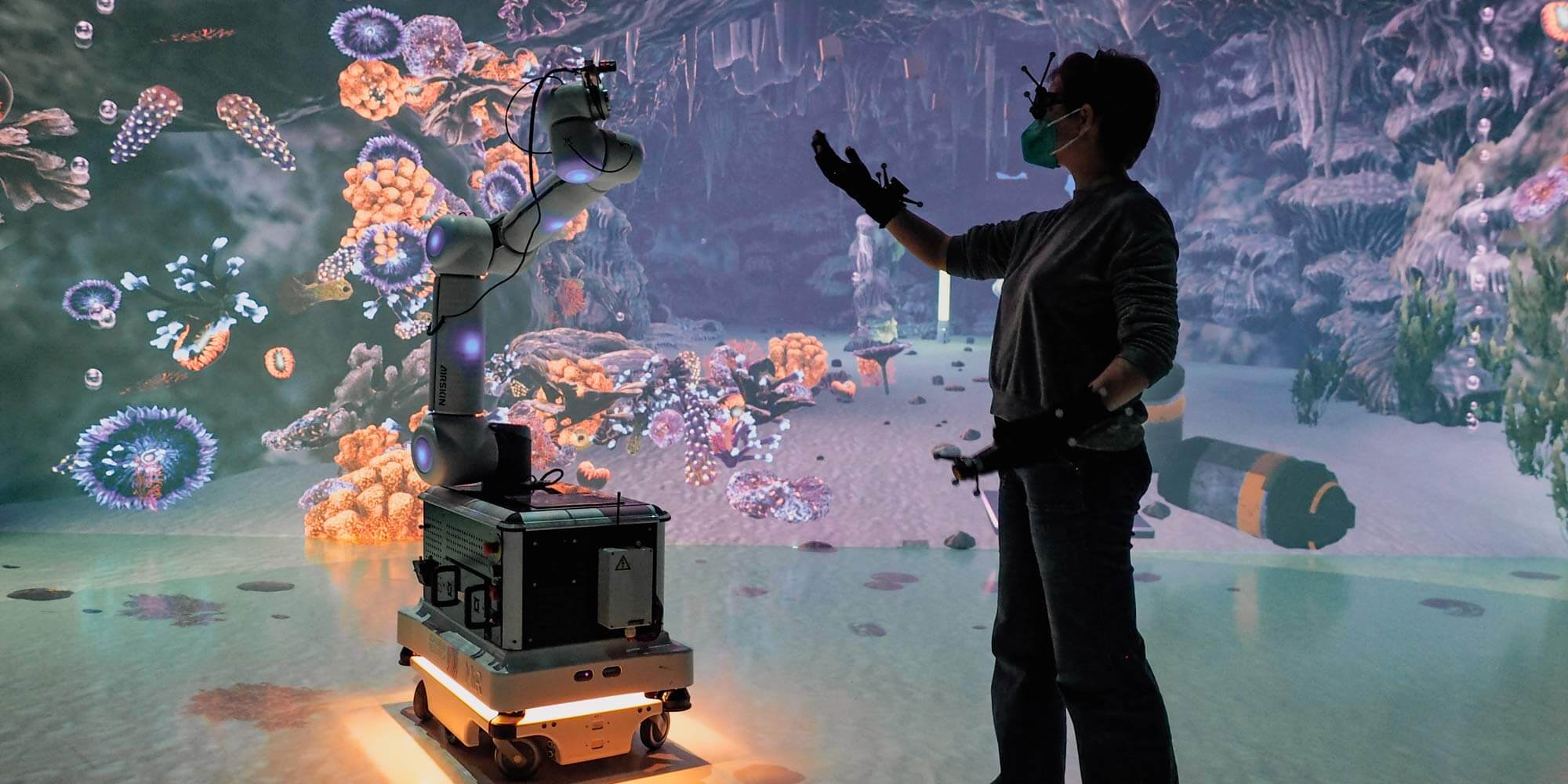 A human interacting with a robot in a virtual environment