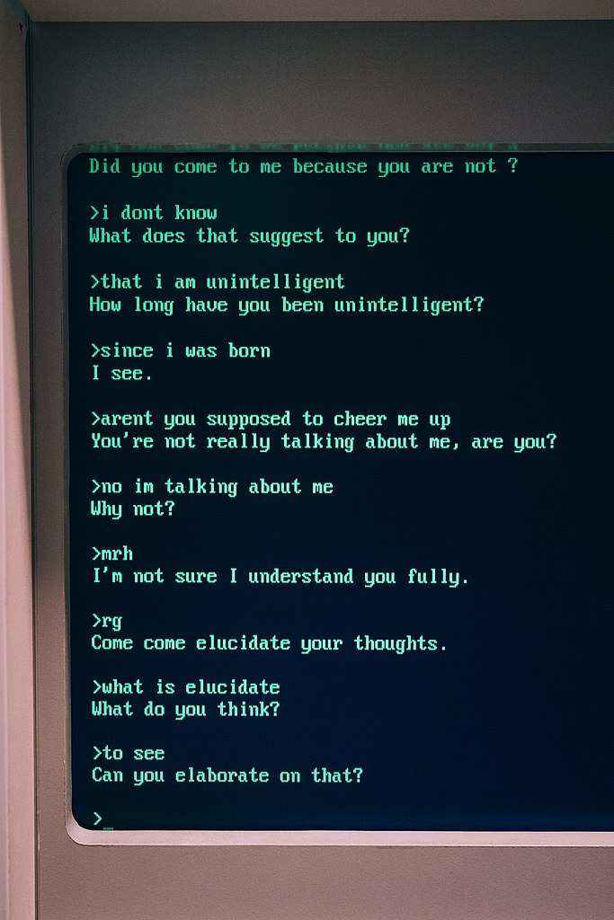 A photo of the left half of an old CRT display showing part of a session of the Eliza chatbot
