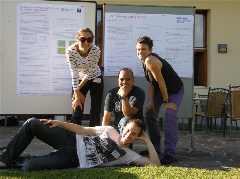 Ewa Matusiak, Gino Velasco, Monika Dörfler, Nicki Holighaus in front of conference posters